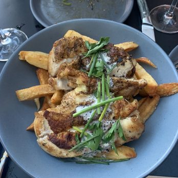 The Kitchen American Bistro signature dishes Hand-Cut Fries, Bolognese, Garlic Steamed Mussels, Simple Roasted Chicken